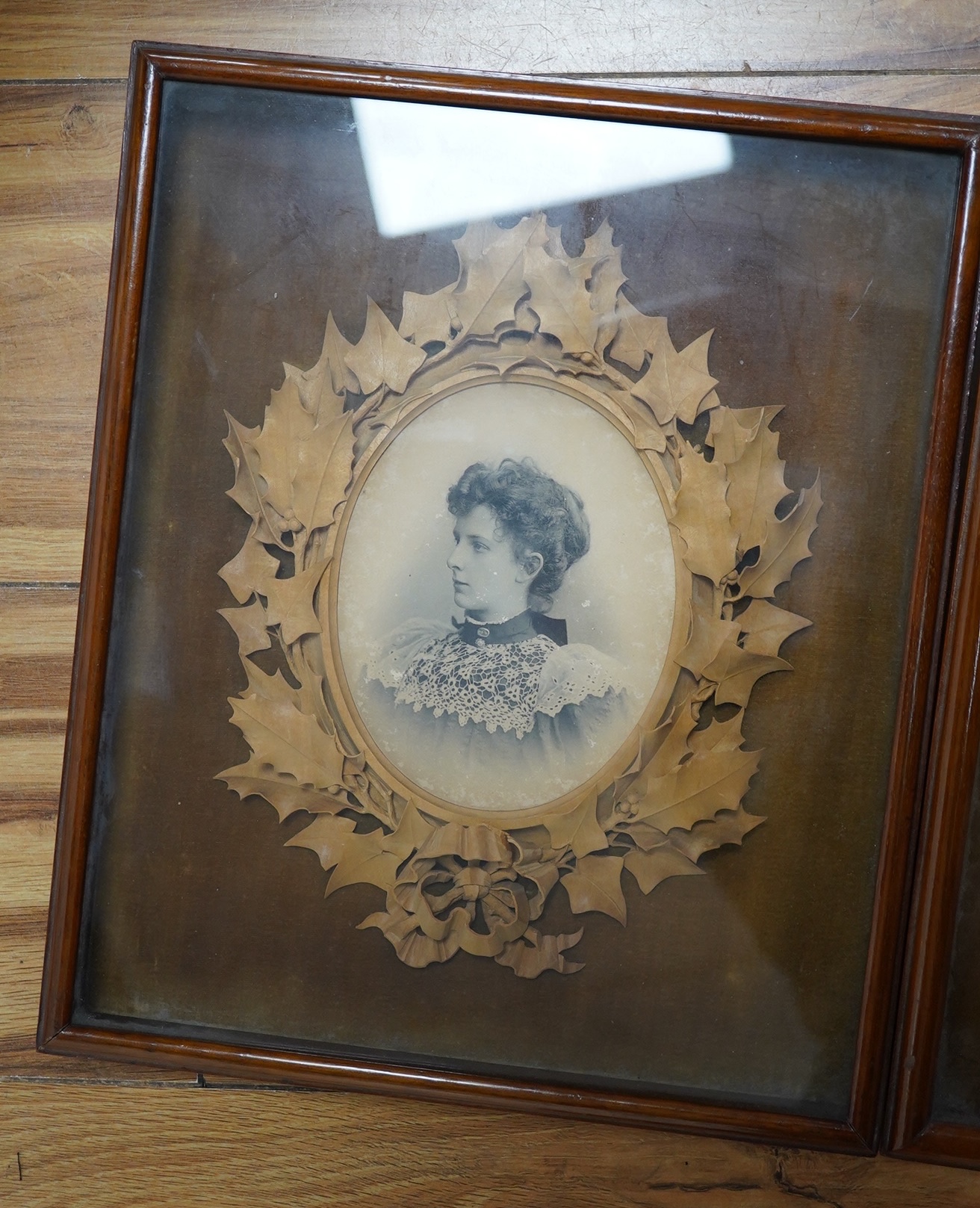 Two photograph frames, finely carved by Alfred Jones, see reverse of both, Margaret Edmondson frame 25cm wide x 30cm high. Condition - good